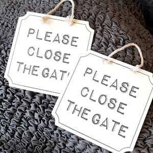 Two “Please close the gate” signs